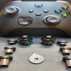Xbox Elite controller with removed thumbstick modules and parts